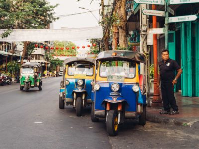 man-standing-beside-parked-trikes-2078248